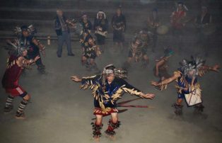 first nations youth performing traditional dance