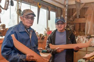 two men in a canoe workshop