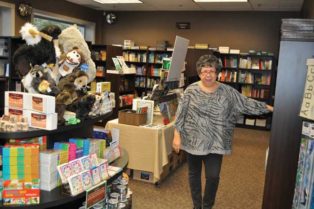 woman standing in bookstore