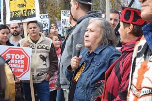 woman speaks to a crowd