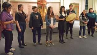 women drumming and singing