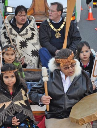 mayor and first nations members in a parade