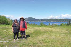 people standing on site of future ocean-front garden