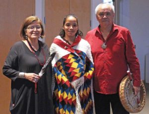 family with woven blanket