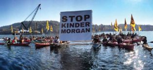 protestors in kayaks