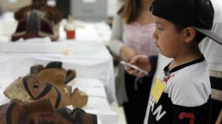 child looking at masks