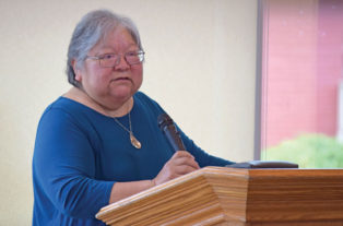 Lorna Williams speaking from a podium