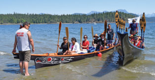 Canoes coming up on a beach