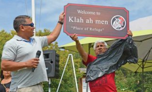 Clint Williams and John Jouie with new sign