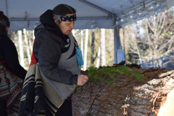 Squamish carvers build canoe at CapU